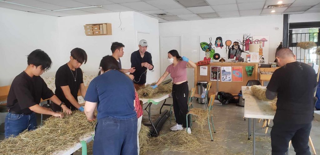 Volunteers helping build the body of the fire dragon on September 10, 2023. Photo credit: Russell Chiong.