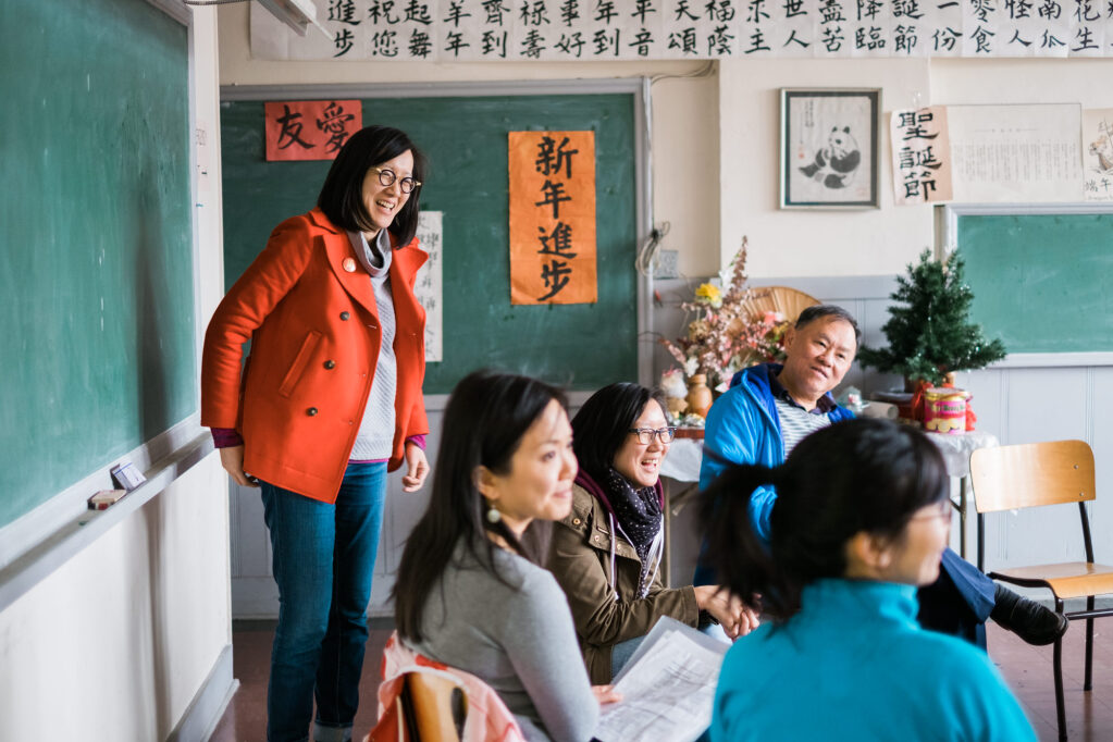 June Chow of the Youth Collaborative for Chinatown with Saturday School students at Mon Keang School on February 18, 2017. Photo Credit; Jonathan Desmond.