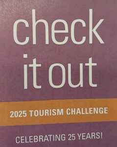 White text on a purple and yellow background, reading "check it out - 2025 Tourism Challenge – celebrating 25 years"