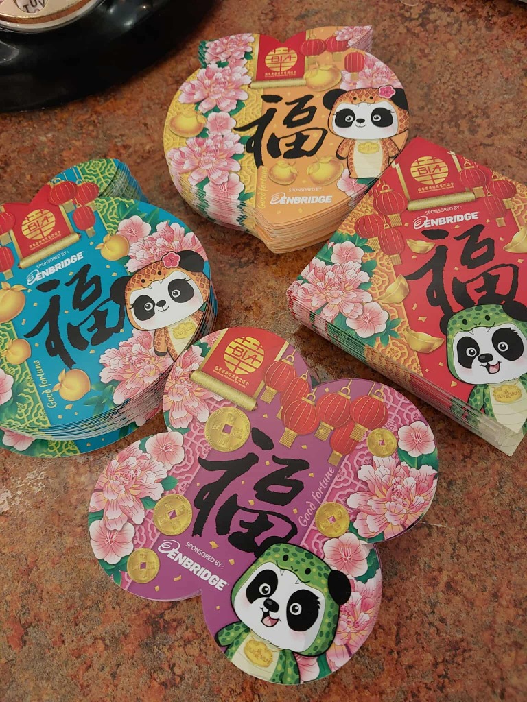 Picture of the four 揮春 (fai1 cun1 | huī chūn) that tourism challenge participants must collect to receive the Chinatown neighbourhood stamps.